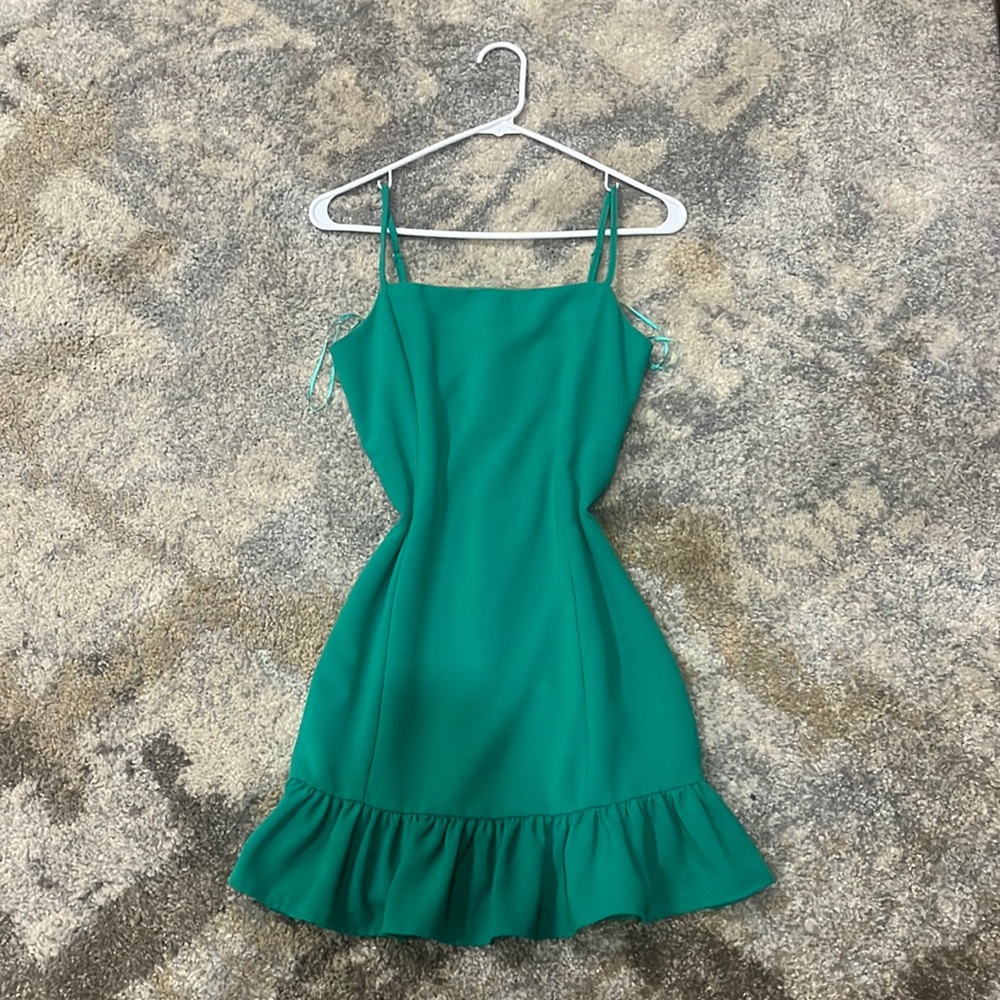 Beautiful green dress with frills at the bottom, bought from a boutique